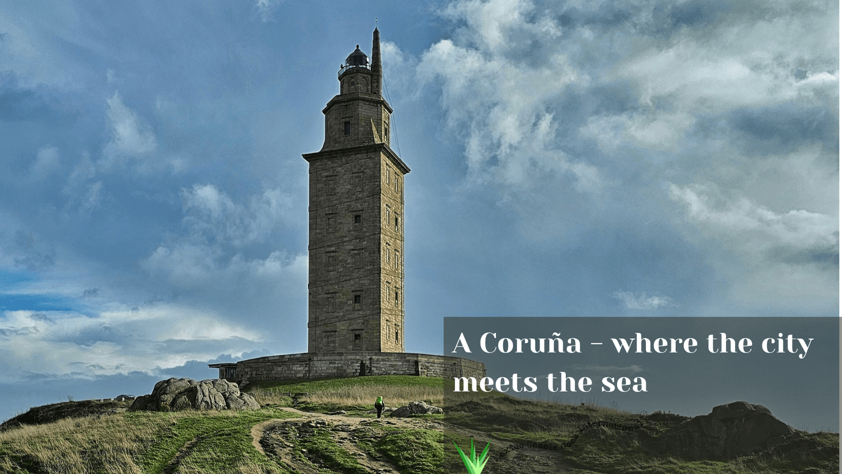 Torre de Hercules - cloudy day. Text in right hand corner says "A Coruña - where the city meets the sea"