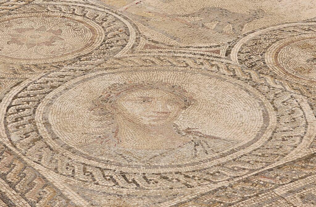 mosaic floor, person's face in a circle