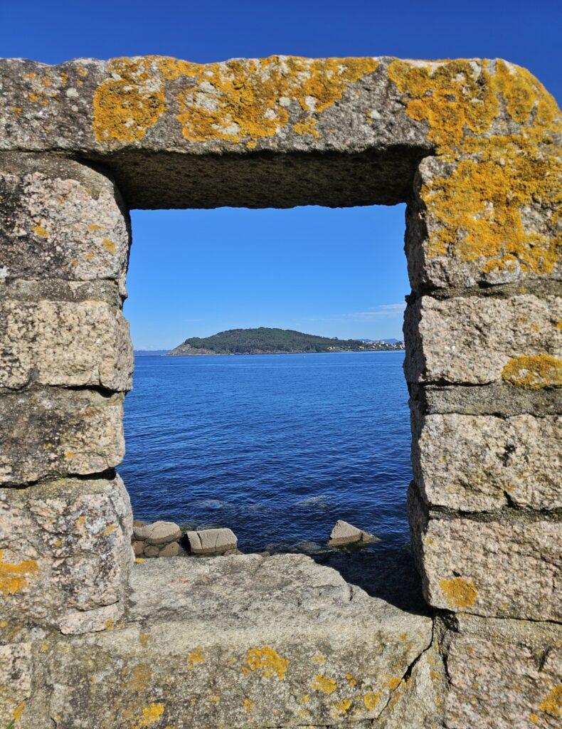 window with view of blue sea and island