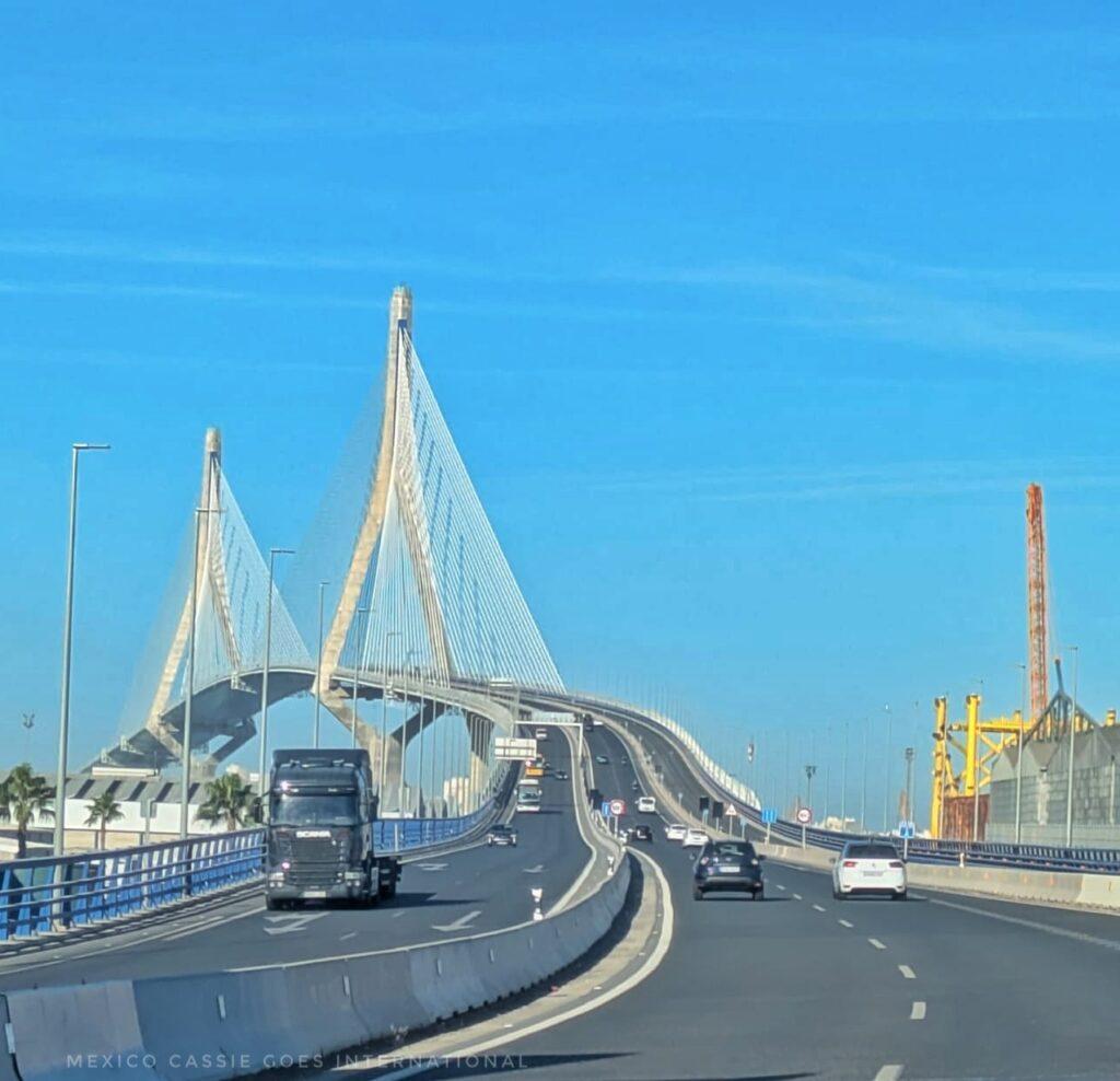 bridge into Cádiz, blue sky. bridge has two triangular sections